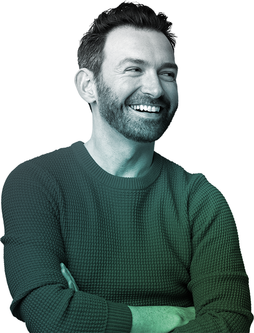 Man in sweater laughing